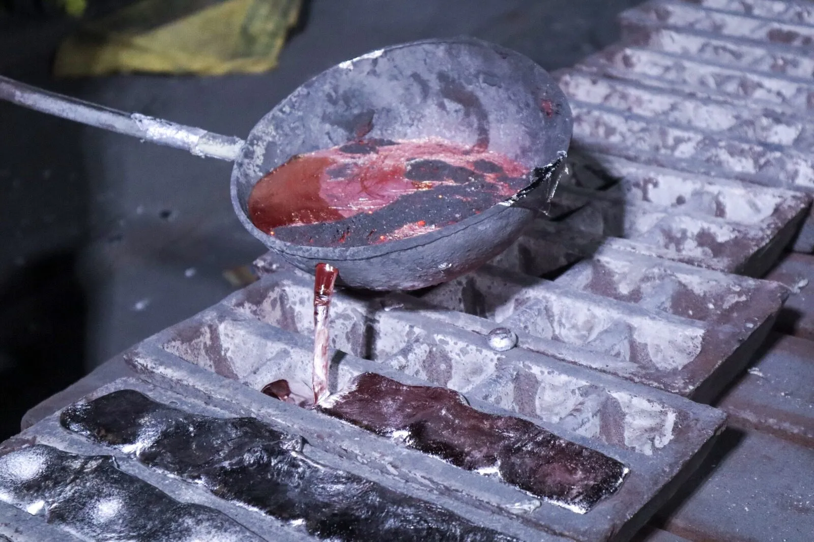 Molten aluminium poured from a ladle into ingot moulds at the Howrah plant